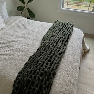 Dark green chunky knit blanket